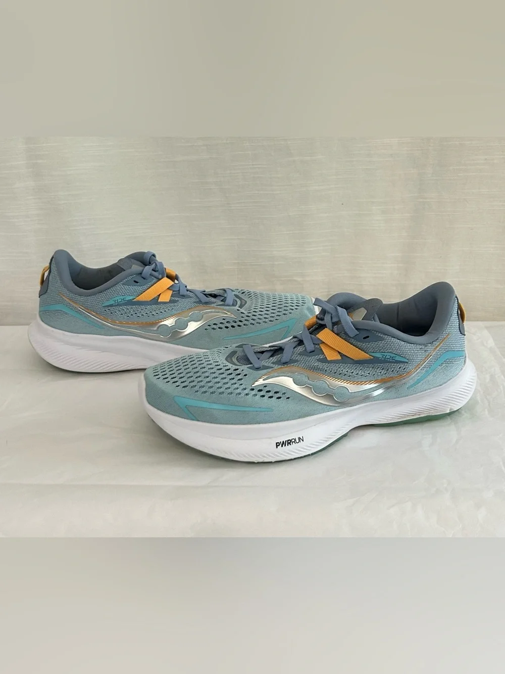 Saucony Ride 15 Women's Light Blue Athletic Sneakers with Yellow Accents